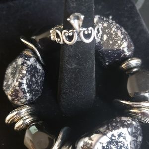 Black necklace with an added bracelet and ring